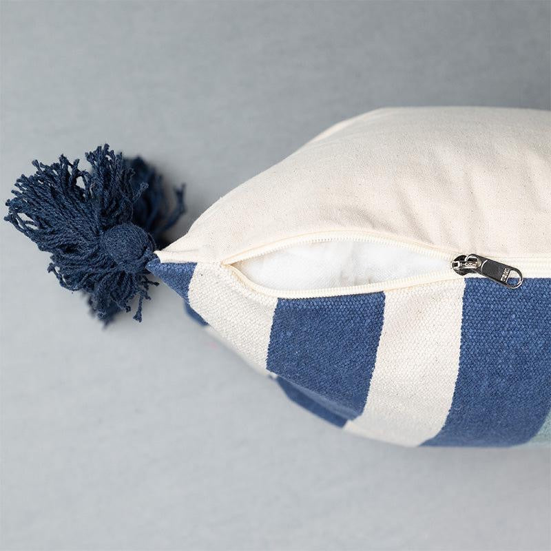 Side view of the Checks and Stripes Cushion, a square accent pillow with tassels and modern prints you can buy online at Sukham Home, a sustainable furniture, kitchen & dining and home decor store in Kolkata, India.