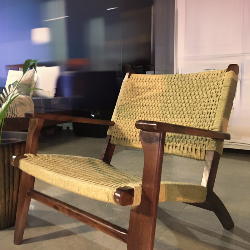 Close view of the Dori Story Armchai, a cotton and sheesham seat woven in Rajasthan, available at Sukham Home, a sustainable furniture, kitchen & dining and home decor store in Kolkata, India