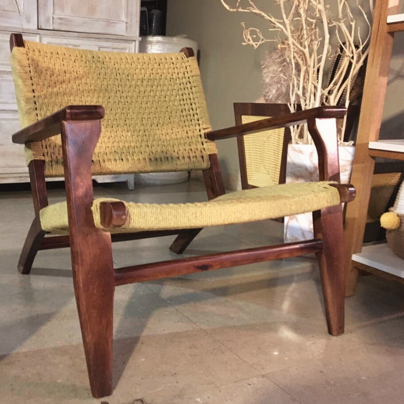 Full view of the Dori Story armchair, a cotton and sheesham seat woven in Rajasthan, available at Sukham Home, a sustainable furniture, kitchen & dining and home decor store in Kolkata, India