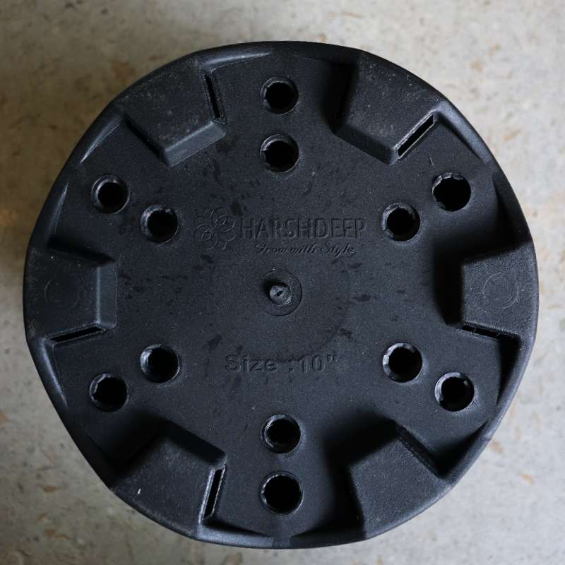 Bottom of the 10 inch black nursery pot and gardening tools you can buy online at Sukham Home, a sustainable furniture, gardening and home decor store in Kolkata, India