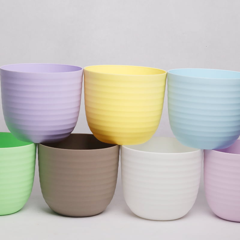 All colours of Verona, a round colourful indoor planter made from plastic that you can buy online at Sukham Home, a sustainable furniture, gardening and home decor store in Kolkata, India