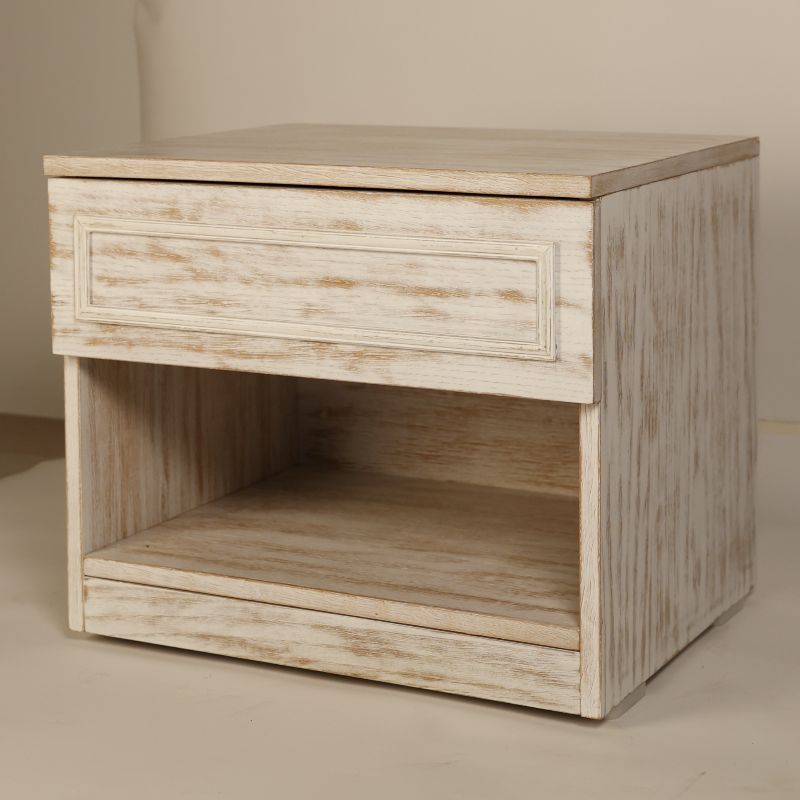 Tilted angled view of the Archaic Bedside Table, a wooden white patina nightstand inspired by harbour and coastal style furniture you can buy online at Sukham Home, a sustainable furniture, kitchen & dining and home decor store in Kolkata, India