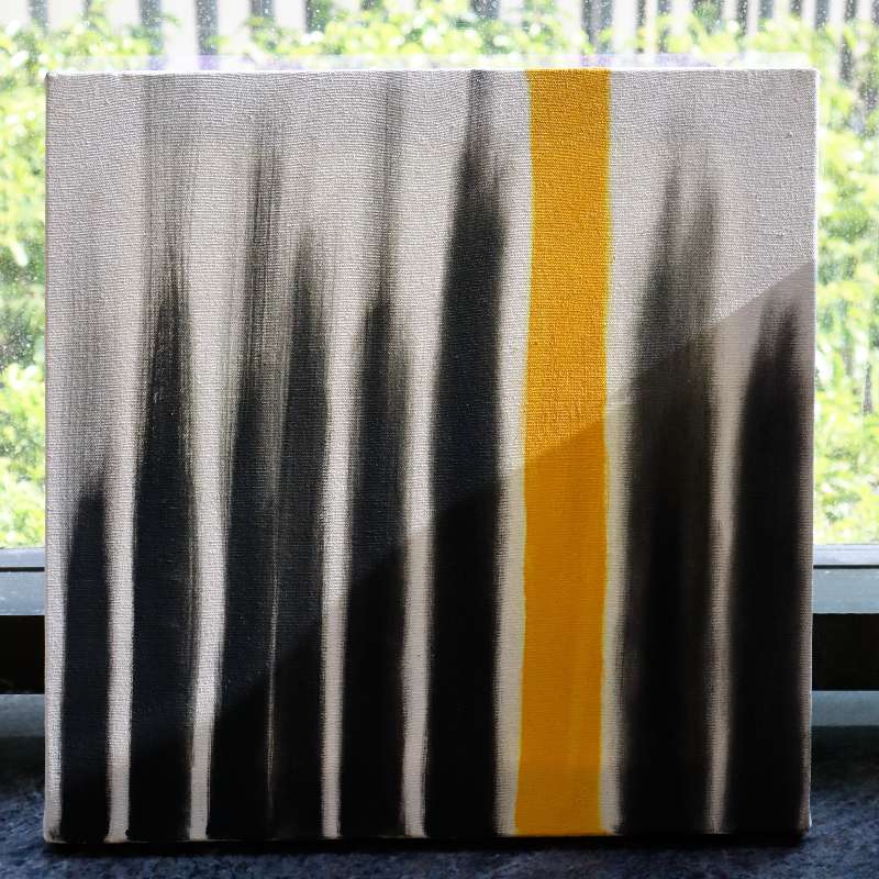 Placed by a window, The Light I Seek painting, a yellow, black and white canvas artwork you can buy online at Sukham Home, a sustainable furniture, kitchen & dining and home decor store in Kolkata, India