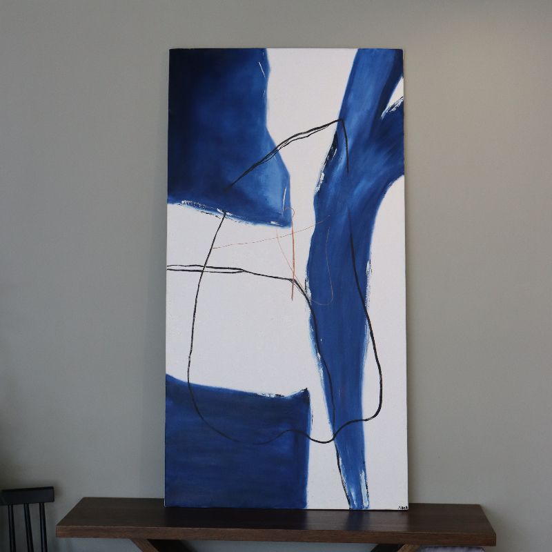Placed on a console, The Deep Ocean painting, a blue and white canvas artwork you can buy online at Sukham Home, a sustainable furniture, kitchen & dining and home decor store in Kolkata, India
