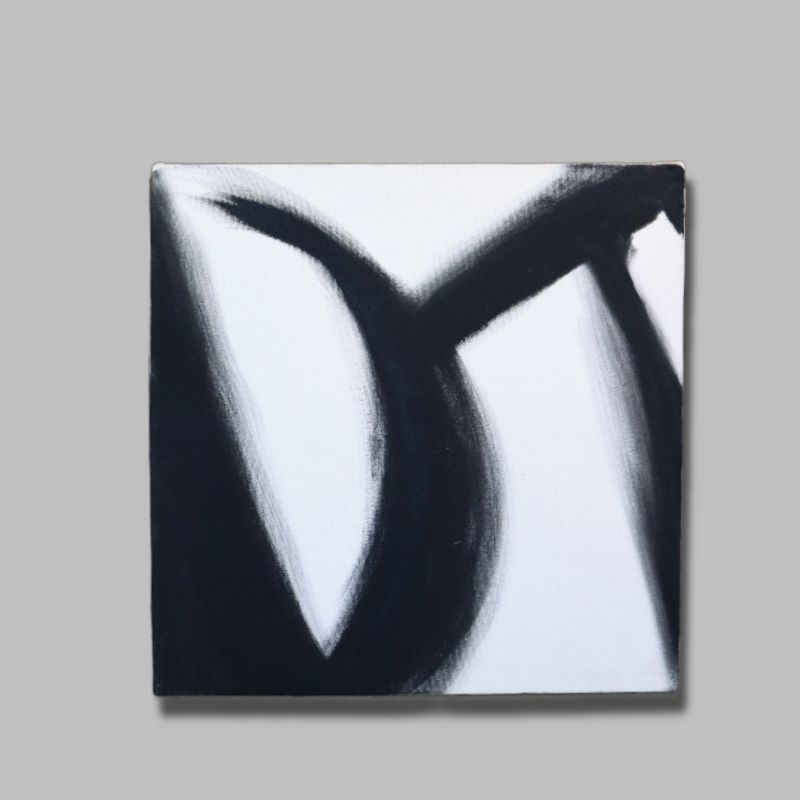 Against a grey background, The Black Stroke painting, a black and white canvas artwork you can buy online at Sukham Home, a sustainable furniture, kitchen & dining and home decor store in Kolkata, India