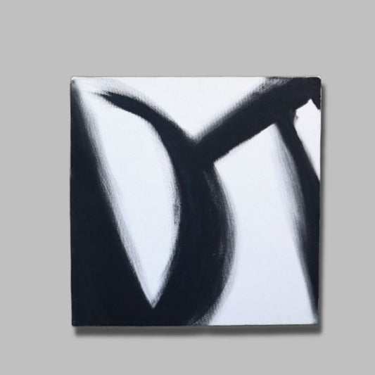 Against a grey background, The Black Stroke painting, a black and white canvas artwork you can buy online at Sukham Home, a sustainable furniture, kitchen & dining and home decor store in Kolkata, India