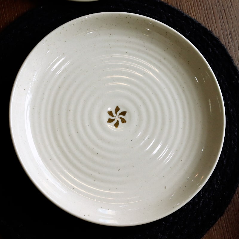 Top view of the Beige Ganga Dinner Plate - a beige and 24-karat gold ceramic plate you can buy online at Sukham Home, a sustainable furniture, gardening and home decor store in Kolkata, India