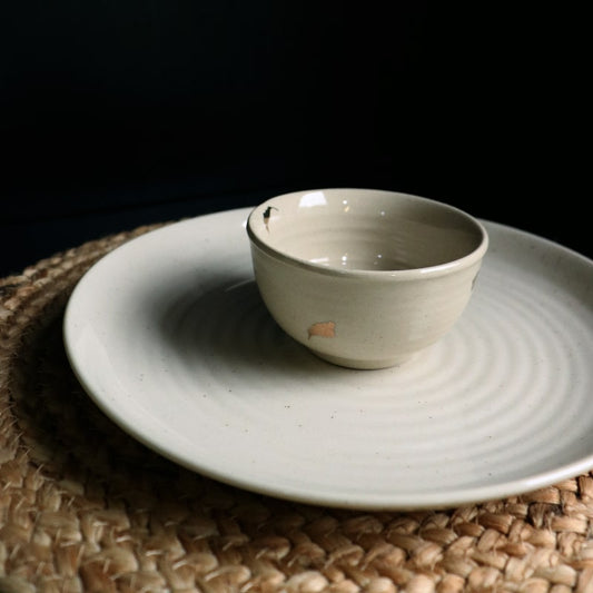Beige Ganga Small Bowl and Beige Ganga Dinner Plate - a beige and 24-karat gold ceramic plate you can buy online at Sukham Home, a sustainable furniture, gardening and home decor store in Kolkata, India