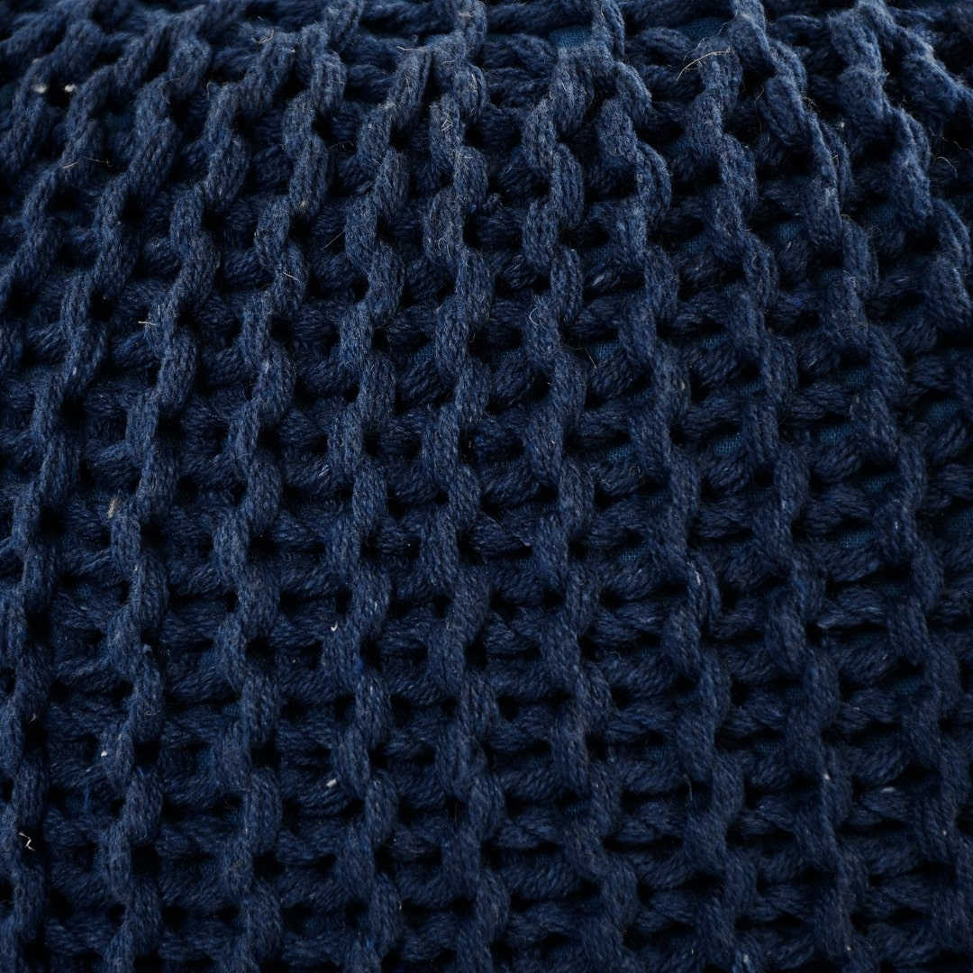 Close up of the texture of the fabric on the Blue Knitted Pouf, a navy blue ottoman made from cotton, available at Sukham Home, a sustainable furniture, kitchen & dining and home decor store in Kolkata, India
