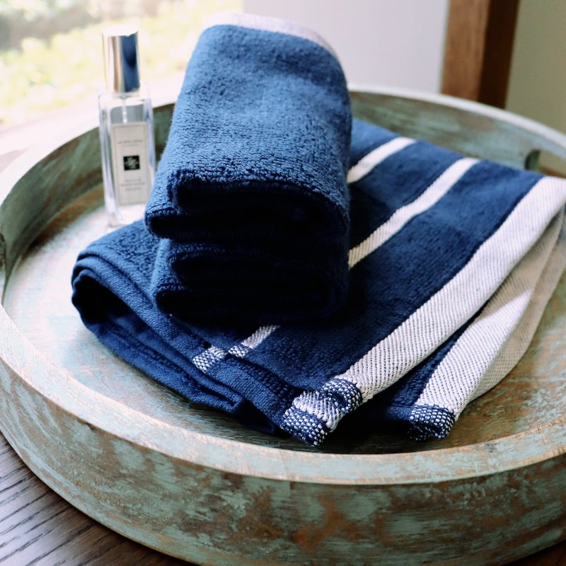 Two face towels from the Blue Oh-So-Soft, a set of 6 navy towels you can buy online at Sukham Home, a sustainable furniture, kitchen & dining and home decor store in Kolkata, India