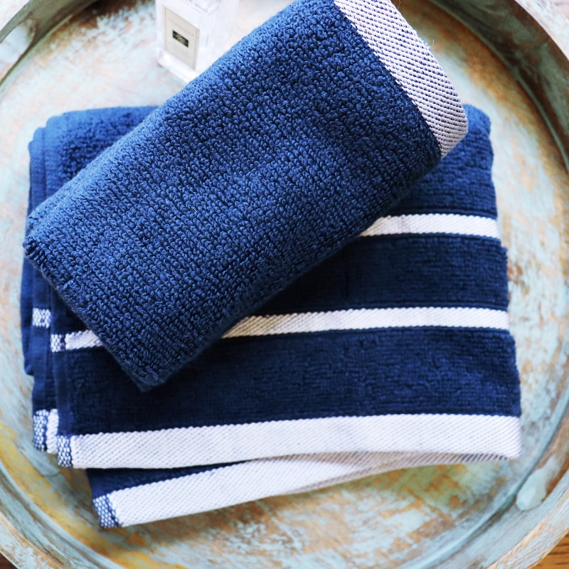 Top view of the folded face towels from the Blue Oh-So-Soft, a set of 6 navy towels you can buy online at Sukham Home, a sustainable furniture, kitchen & dining and home decor store in Kolkata, India