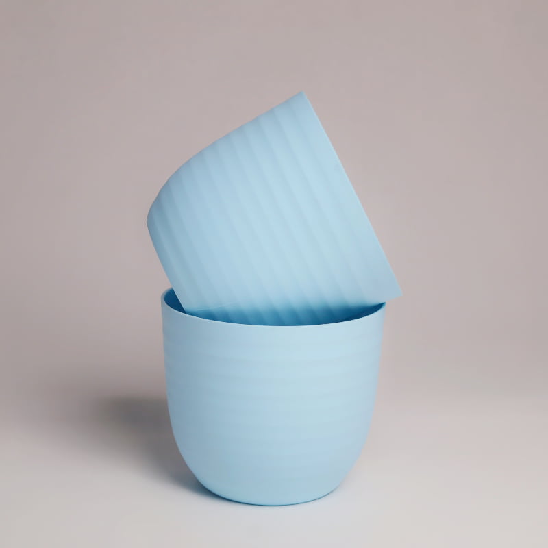 Two blue Verona, a round colourful indoor planter made from plastic that you can buy online at Sukham Home, a sustainable furniture, gardening and home decor store in Kolkata, India