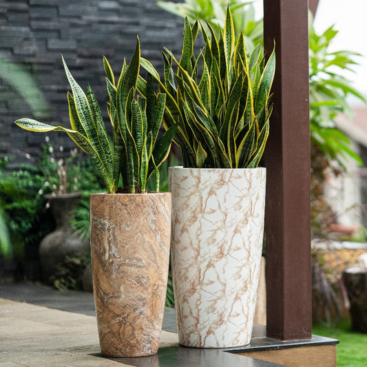 Big White Italian Marble finish and Small Brown Italian Marble finish in the Cono, a large round tall textured luxury planter made from FRP you can buy online at Sukham Home, a sustainable furniture, gardening and home decor store in Kolkata, India