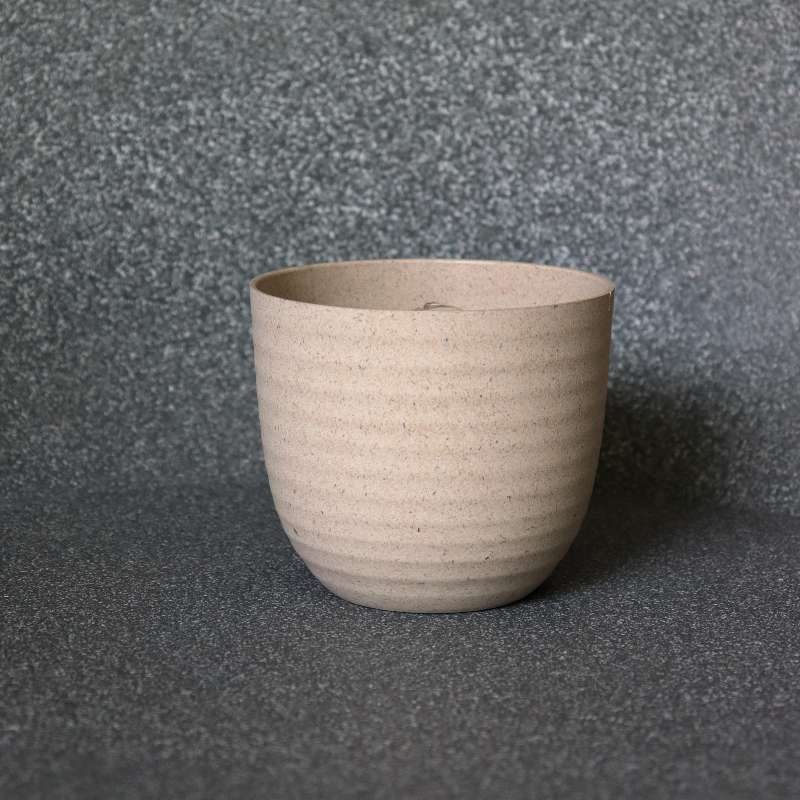 In size 11 and cream colour, the Verona Eco Series, a round textured indoor planter made from plastic and crop waste that you can buy online at Sukham Home, a sustainable furniture, gardening and home decor store in Kolkata, India