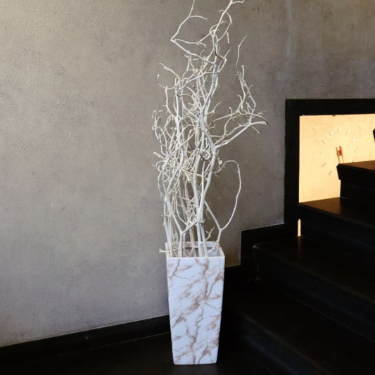 In White Italian Marble finish, the Cubico, a large square tall textured luxury planter made from FRP you can buy online at Sukham Home, a sustainable furniture, gardening and home decor store in Kolkata, India