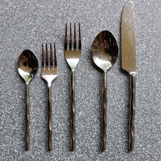 Whole set of Forged Wonder flatware set of stainless steel cutlery you can buy online at Sukham Home, a sustainable furniture, kitchen & dining and home decor store in Kolkata, India