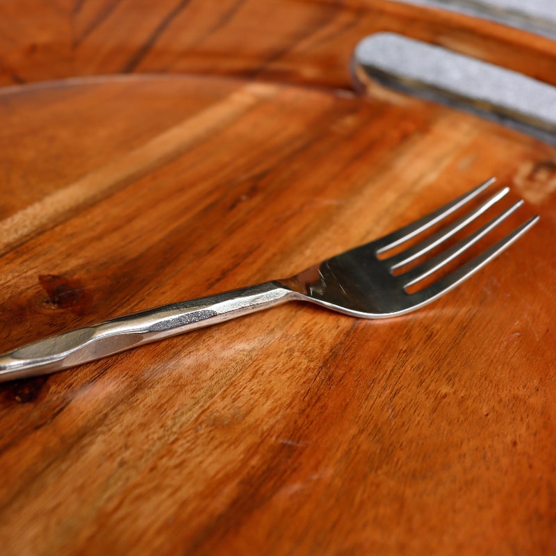 Dinner fork of the Forged Wonder flatware set of stainless steel cutlery you can buy online at Sukham Home, a sustainable furniture, kitchen & dining and home decor store in Kolkata, India