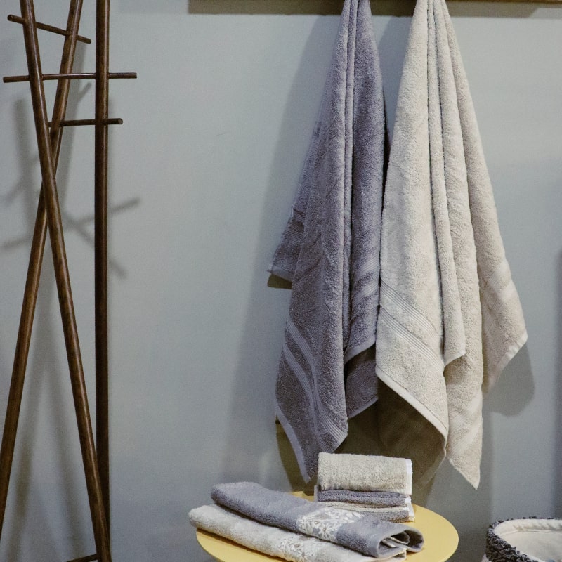 Whole set of the Grey & Beige Silly-Cuddly, a set of 8 floral embroidered towels you can buy online at Sukham Home, a sustainable furniture, kitchen & dining and home decor store in Kolkata, India