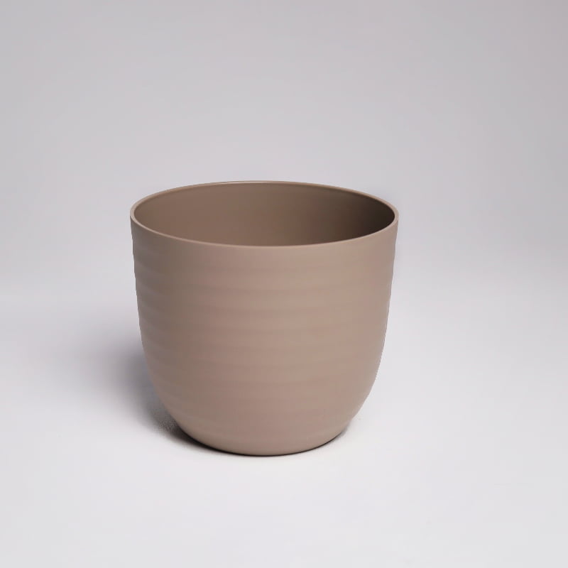 A single brown mocha Verona, a round colourful indoor planter made from plastic that you can buy online at Sukham Home, a sustainable furniture, gardening and home decor store in Kolkata, India