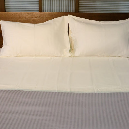 Full set of the Moon White Classic Solid Bedsheet, a cream king size and queen size cotton bedsheet you can buy online at Sukham Home, a sustainable furniture, gardening and home decor store in Kolkata, India