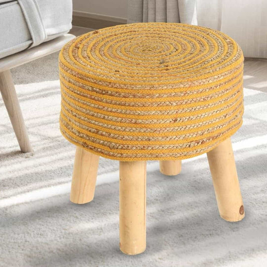 Placed on a carpet, Mustard Circle of Life Stool, a yellow ottoman made from jute, cotton and mango wood, available at Sukham Home, a sustainable furniture, kitchen & dining and home decor store in Kolkata, India