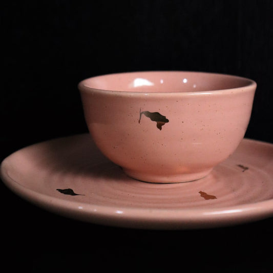 Side view of Old Rose Ganga Small Bowl, a pink and 24-karat gold ceramic small bowl you can buy online at Sukham Home, a sustainable furniture, gardening and home decor store in Kolkata, India