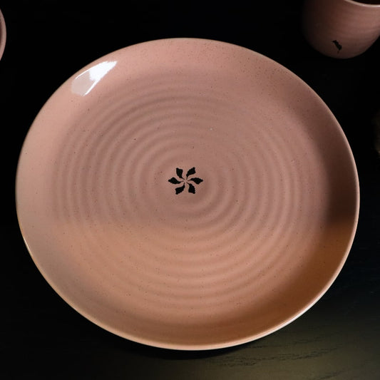 Top view of the Old Rose Ganga Dinner Plate, a pink and 24-karat gold ceramic plate you can buy online at Sukham Home, a sustainable furniture, gardening and home decor store in Kolkata, India