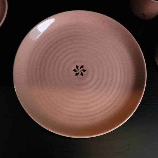 Detailed view of the gold flakes and ribbed style on the Old Rose Ganga Dinner Plate, a pink and 24-karat gold ceramic plate you can buy online at Sukham Home, a sustainable furniture, gardening and home decor store in Kolkata, India
