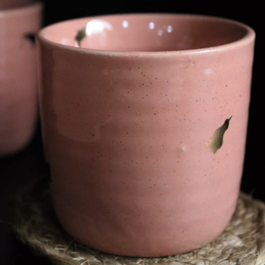 Close up of the Old Rose Ganga Kulhad, a pink and 24-karat gold ceramic glass/cup you can buy online at Sukham Home, a sustainable furniture, gardening and home decor store in Kolkata, India