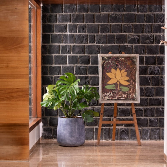 In a corner of the house, the Grey Ceramic Pearl, a round textured luxury planter made from FRP you can buy online at Sukham Home, a sustainable furniture, gardening and home decor store in Kolkata, India