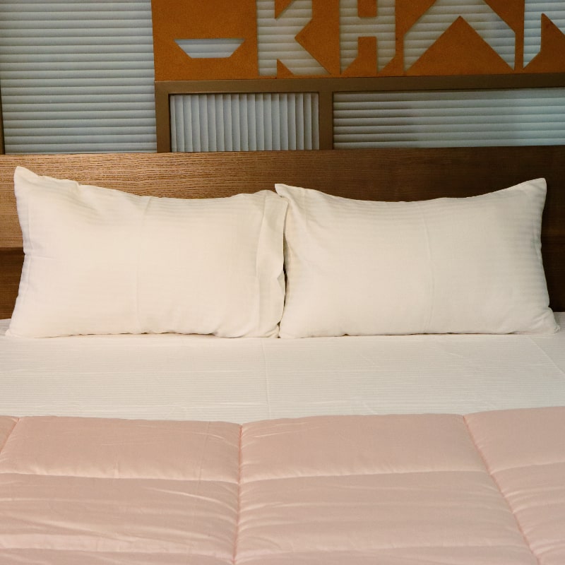 Whole set of the White Sateen Striped Bedsheet, a king and queen size cotton bedsheet you can buy online at Sukham Home, a sustainable furniture, gardening and home decor store in Kolkata, India