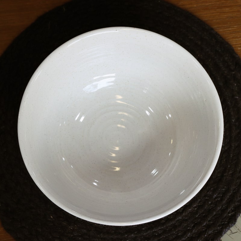 Top view of the Ivory Ganga Serving Bowl, a white and 24-karat gold ceramic serving big bowl you can buy online at Sukham Home, a sustainable furniture, gardening and home decor store in Kolkata, India