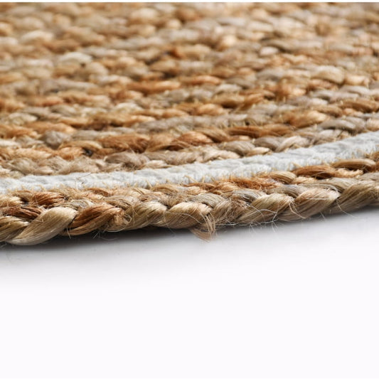 Close up of the finishing on the ends of the Braided Round Jute Rug with White Border, a circular jute and white cotton carpet you can buy online at Sukham Home, a sustainable furniture, kitchen & dining and home decor store in Kolkata, India
