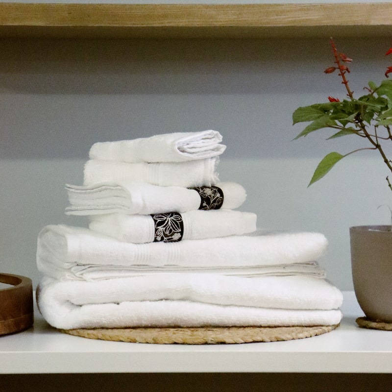 Whole set of White Silly-Cuddly, a set of 8 white floral towels you can buy online at Sukham Home, a sustainable furniture, kitchen & dining and home decor store in Kolkata, India