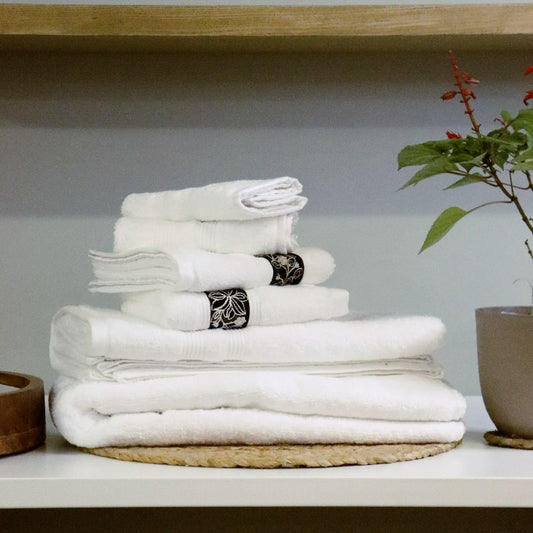 Whole set of White Silly-Cuddly, a set of 8 white floral towels you can buy online at Sukham Home, a sustainable furniture, kitchen & dining and home decor store in Kolkata, India