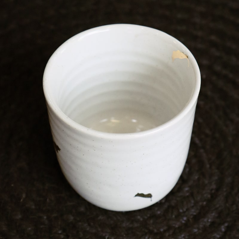 Top view of the Ivory Ganga Kulhad, an pure white and 24-karat gold ceramic cup/glass you can buy online at Sukham Home, a sustainable furniture, gardening and home decor store in Kolkata, India