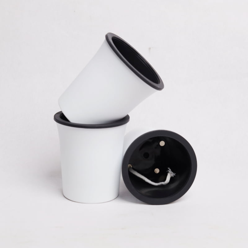 Two stacked together, the Oslo, a round white, self watering indoor planter made from plastic that you can buy online at Sukham Home, a sustainable furniture, gardening and home decor store in Kolkata, India