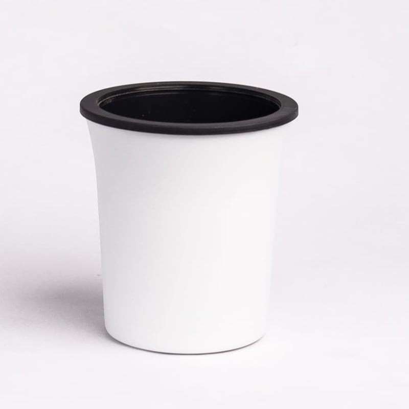 Side view of the Oslo, a round white, self watering indoor planter made from plastic that you can buy online at Sukham Home, a sustainable furniture, gardening and home decor store in Kolkata, India