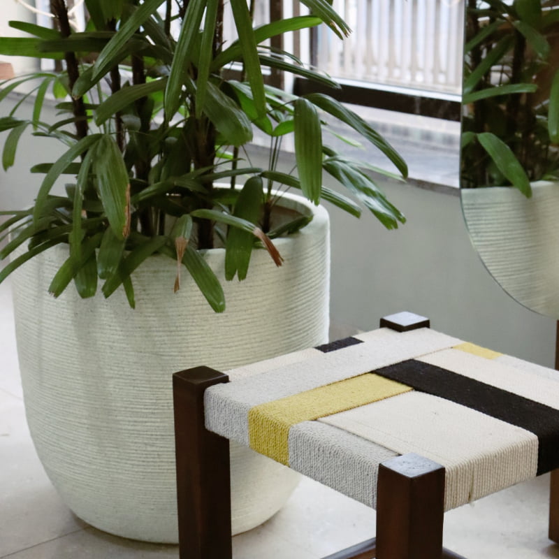 The large White Stone Rib Short, a round textured luxury planter made from FRP you can buy online at Sukham Home, a sustainable furniture, gardening and home decor store in Kolkata, India