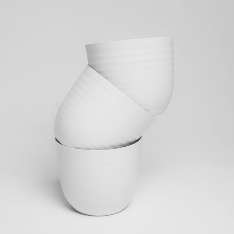 Three pieces stacked of white Verona, a round colourful indoor planter made from plastic that you can buy online at Sukham Home, a sustainable furniture, gardening and home decor store in Kolkata, India