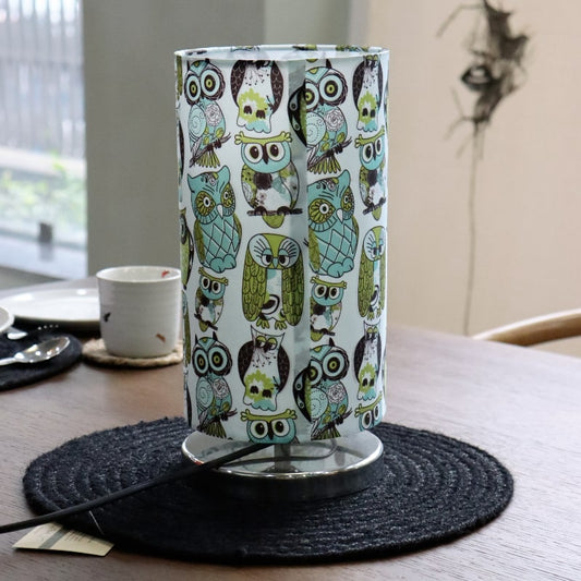 Placed on a table without the light on, Wise Owl, a cloth canvas table lamp with many quirky owl designs you can buy online at Sukham Home, a sustainable furniture, kitchen & dining and home decor store in Kolkata, India