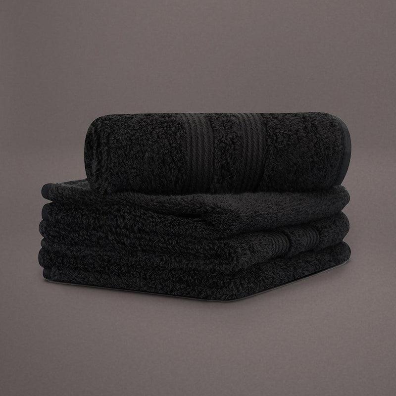 Face towels from the Black Silly-Cuddly, a set of 8 black & gold towels you can buy online at Sukham Home, a sustainable furniture, kitchen & dining and home decor store in Kolkata, India