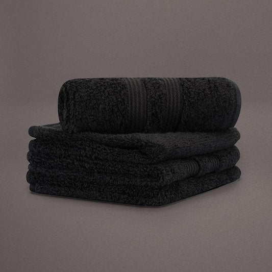 Face towels from the Black Silly-Cuddly, a set of 8 black & gold towels you can buy online at Sukham Home, a sustainable furniture, kitchen & dining and home decor store in Kolkata, India