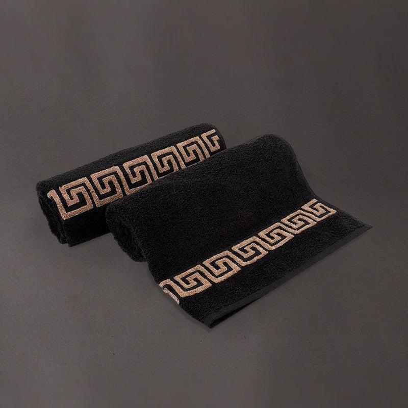 Two embroidered bath towels from the Black Silly-Cuddly, a set of 8 black & gold towels you can buy online at Sukham Home, a sustainable furniture, kitchen & dining and home decor store in Kolkata, India