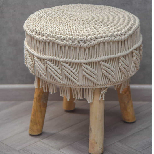 The Alabaster Macrame Stool, a white ottoman made from cotton and mango wood, available at Sukham Home, a sustainable furniture, kitchen & dining and home decor store in Kolkata, India