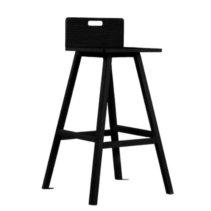 Against a white background, the Ash Charcoal Flamingo Bar Stool, a solid wood high bar chair you can buy online at Sukham Home, a sustainable furniture and home decor store in Kolkata, India