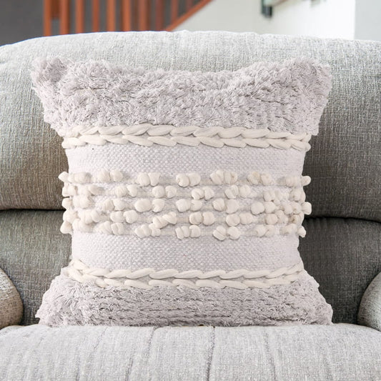 The Aspen Vacations Cushion, a square accent pillow with soft tufts and elegant designs which you can buy online at Sukham Home, a sustainable furniture, kitchen & dining and home decor store in Kolkata, India.