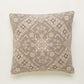 Against white background a piece of the Badami Cushion, a square accent pillow with ethnic prints you can buy online at Sukham Home, a sustainable furniture, kitchen & dining and home decor store in Kolkata, India.