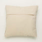 Back of a piece of the Badami Cushion, a square accent pillow with ethnic prints against white background you can buy online at Sukham Home, a sustainable furniture, kitchen & dining and home decor store in Kolkata, India.