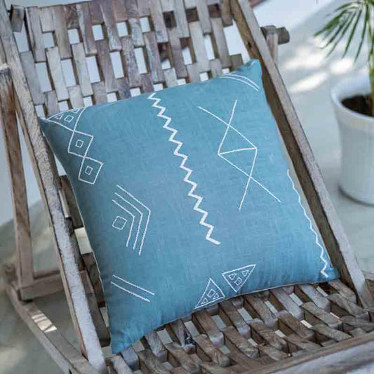 The Blue Grotto Cushion, a square accent pillow in a cerulean blue colour with graceful embroidery you can buy online at Sukham Home, a sustainable furniture, kitchen & dining and home decor store in Kolkata, India.